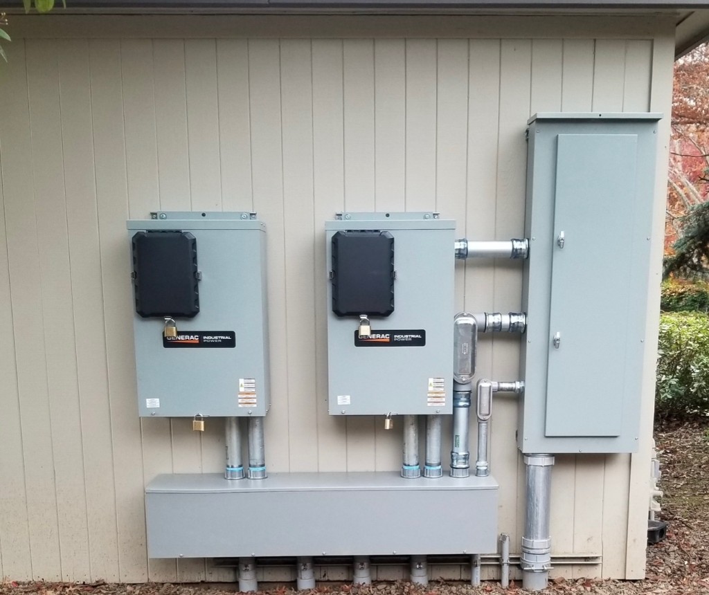 Generac industrial power equipment installed on an exterior wall