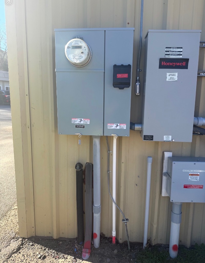 Generator transfer equipment and meter panels mounted on an exterior wall